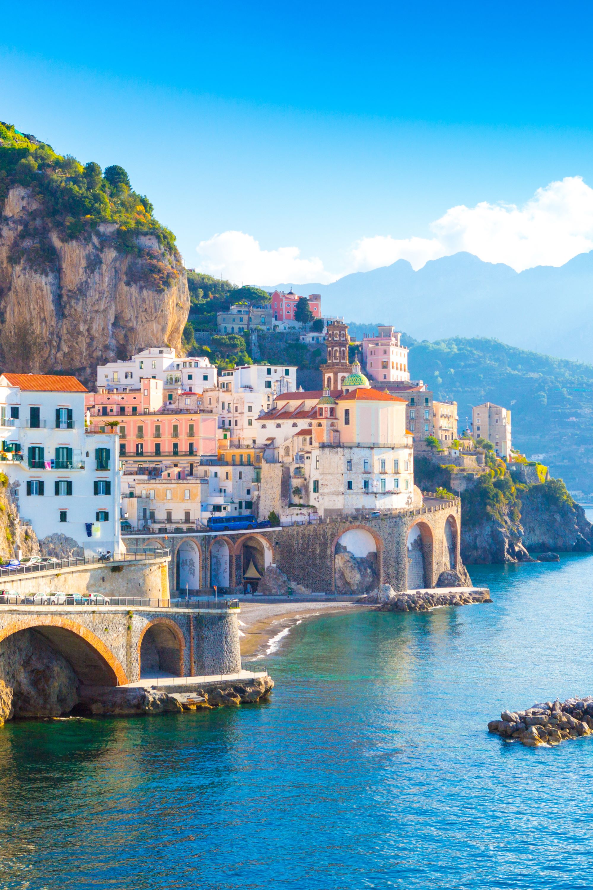 cliffside town overlooking blue water